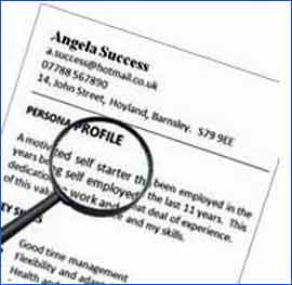 Image Showing a CV Under a Magnifying Glass